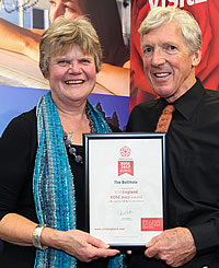 Sally and Christopher receiving their Visit Britain Rose Award