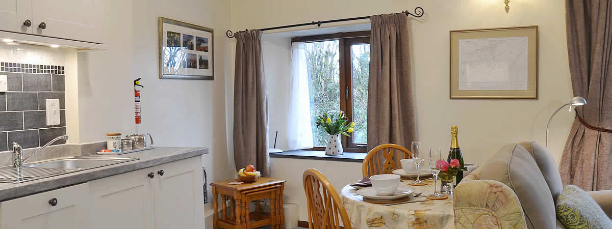 Open plan lounge/diner/kitchen at The Smithy, near Brentor, Devon